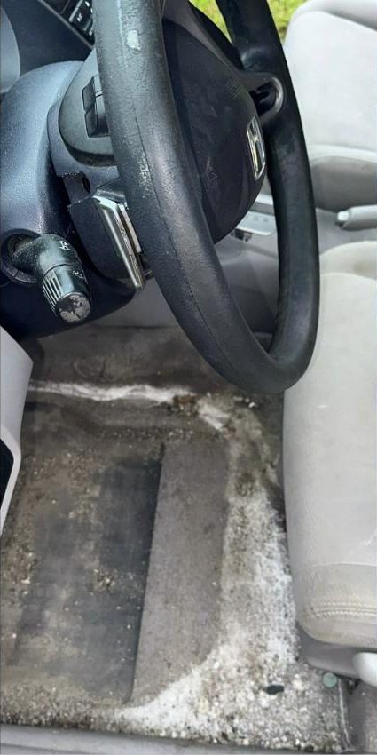 Before interior detailing — Driver's floor — salt & sand out